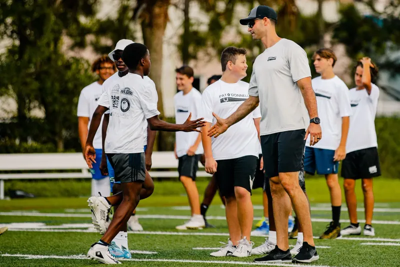 Pat O'Donnell coaching a young athlete at a training camp